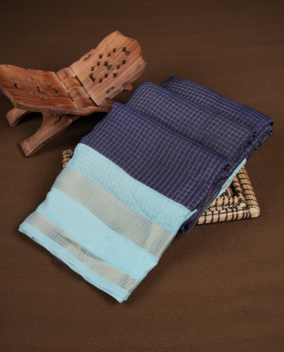 Navy Blue colour saree featuring fine check patterns on the body, paired with a Aqua Blue zari woven border and pallu. Comes with a matching blouse piece