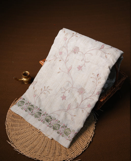 Cream  colour semi tusser silk saree featuring with Green colour thread embroidery kodi pattern all over body, pallu, border  and paired with matching blouse piece.