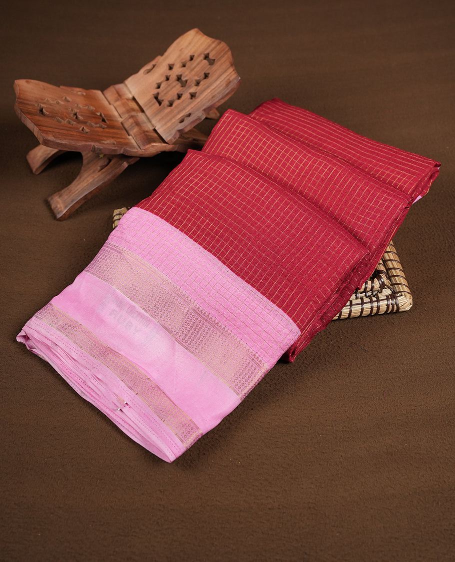 Red colour saree featuring fine check patterns on the body, paired with contrast pink colour zari woven border and pallu. Comes with a matching blouse piece