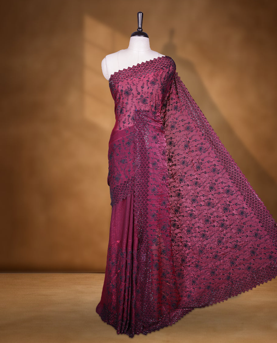 Burgundy colour velvet chiffon designer saree, featuring black thread embroidery kodi pattern on body with black cut stone work and heavy stone border, pallu and Paired with matching blouse.