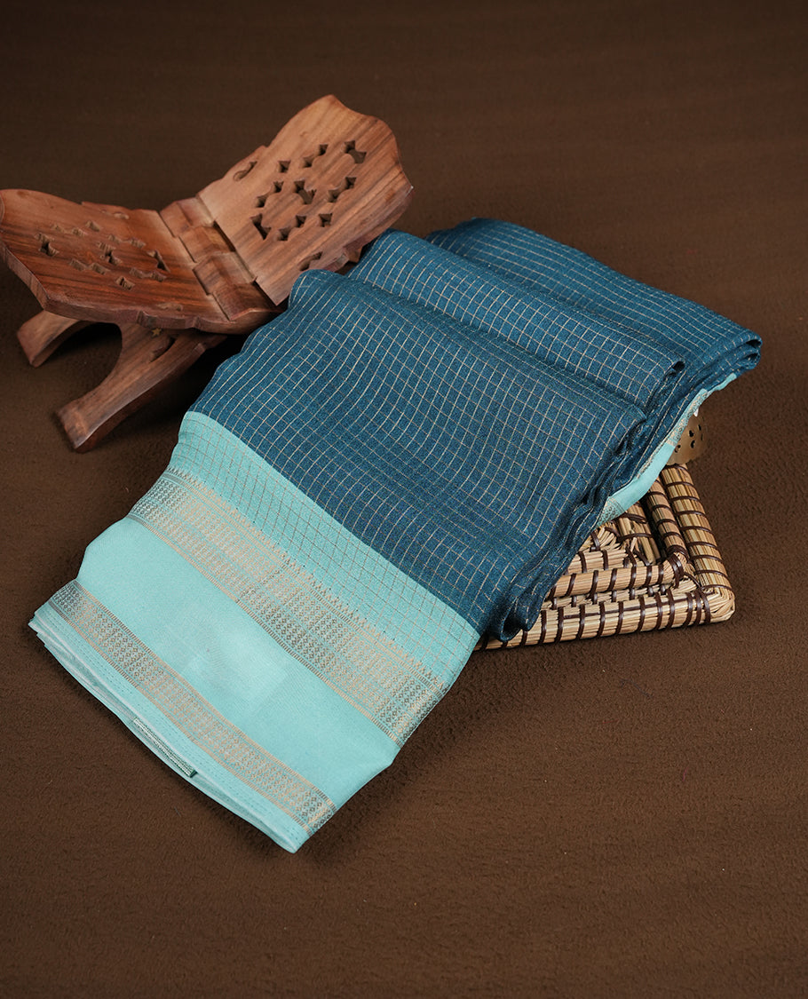 Teal colour saree featuring fine check patterns on the body, paired with contrast Light Aqua colour zari woven border and pallu. Comes with a matching blouse piece
