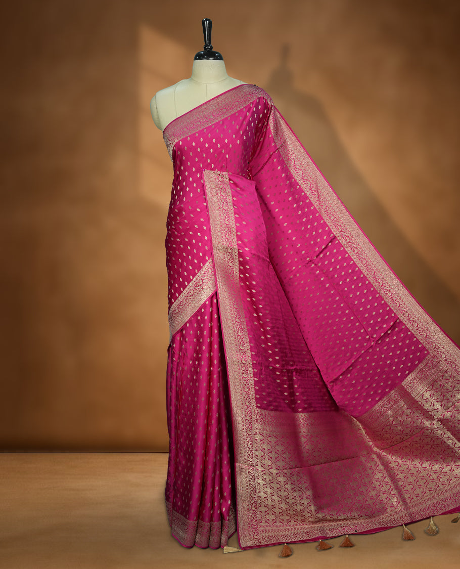 Magenta Colour Semi Banarasi Satin Crepe Saree with Gold Zari Buti Motifs, Traditional Gold Floral Pallu, Elaborate Woven Border, Decorative Tassels with Matching Blouse