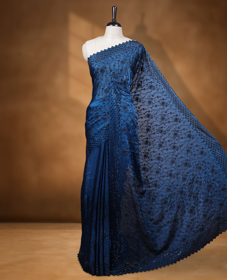 Dark Blue colour velvet chiffon designer saree, featuring black thread embroidery kodi pattern on body, black cut stone work and heavy stone border, pallu and Paired with matching blouse.