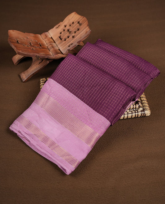 Purple colour saree featuring fine check patterns on the body, paired with contrast pink colour zari woven border and pallu. Comes with a matching blouse piece