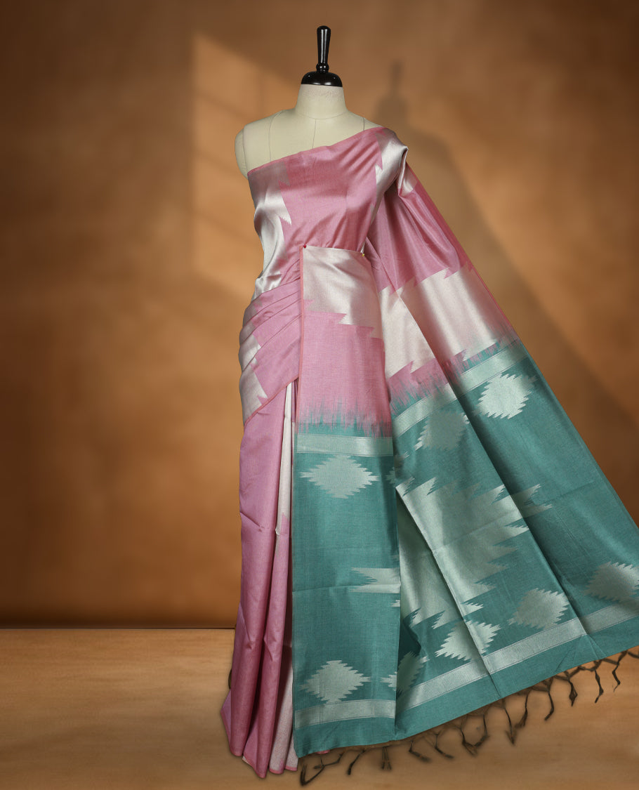 Pink and silver colour dual tone semi tussar saree featuring woven abstract geometric motifs on the body, complemented by a ikat inspired contrast Aqua green patterned pallu, paired with a matching blouse.