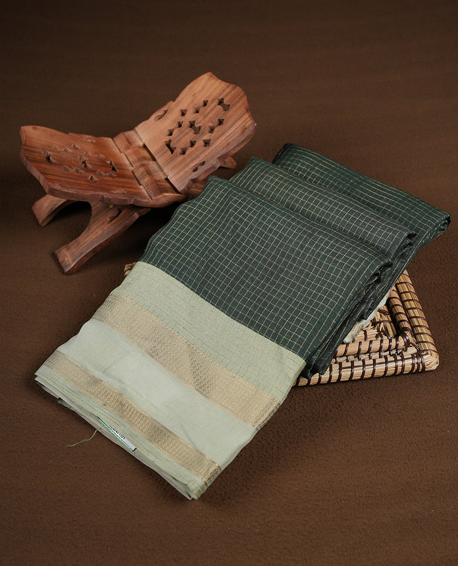 Dark green colour saree featuring fine check patterns on the body, paired with contrast Light green colour zari woven border and pallu. Comes with a matching blouse piece