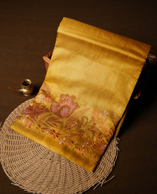 Mustard colour Pure tusser silk saree featuring finely crafted floral thread embroidery detailing on the border, pallu and with matching blouse piece.