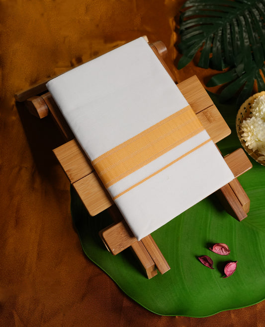 White colour cotton dhoti enhanced with a bright mustard yellow border featuring fine stripe detailing, exuding simplicity and elegance & Perfect choice for festive occasions, rituals, and cultural celebrations.