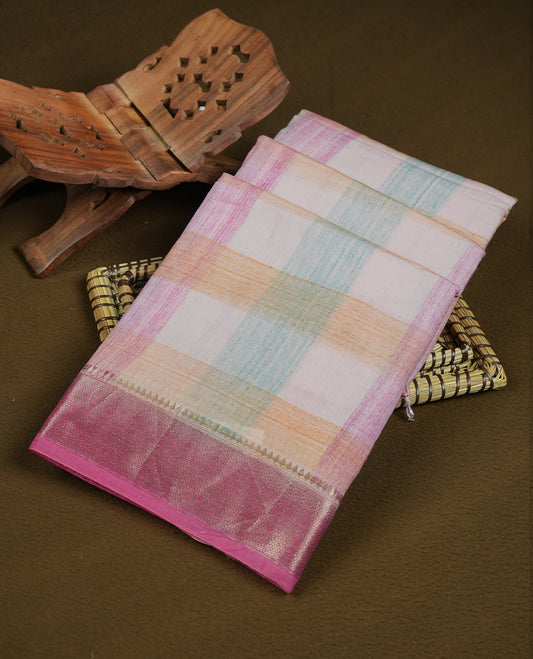 Pastel pink colour mixed chanderi cotton saree featuring checkered body, with silver zari border, and matching checkered blouse.