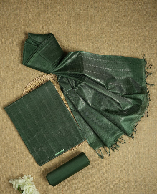 Steel green colour Tussar suit material adorned with intricate silver woven patterns and subtle motifs, exuding ethnic elegance & Paired with a beautifully bordered dupatta and a matching plain bottom.