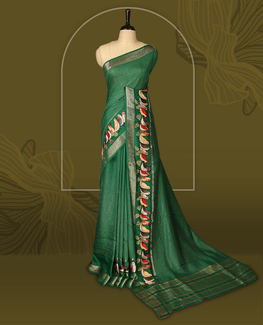 Green viscose saree featuring subtle checkered patterns and a beautifully embroidered bird motif border, paired with a rich pallu & perfect for festive occasions, celebrations, and elegant gatherings.