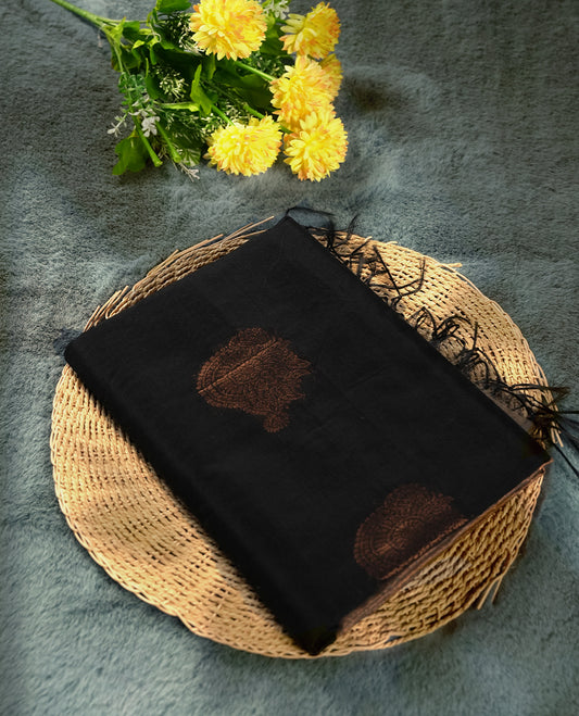 Black colour soft silk cotton saree adorned with copper zari motifs and a shimmering copper zari border, Enhanced by a beautifully rich beige colour woven pallu & Comes with a matching blouse piece for a complete look.