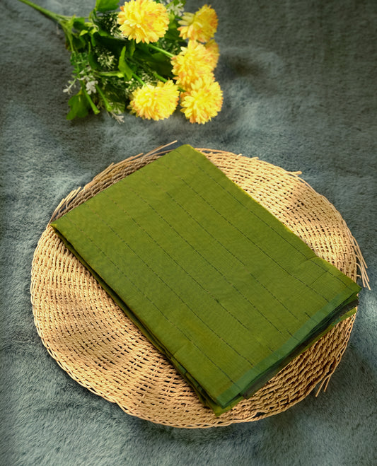 Lemon green colour silk cotton saree featuring with delicate vertical copper zari lines on the body, maroon contrasted border & Crafted without a border for a classy touch, Comes with a matching blouse for a perfectly coordinated look.