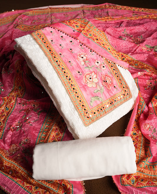White colour churidhar material featuring Mirror and thread embroidery, foral print pattern on the contrast Pink colour front panel, floral digital printed dupatta with elegant border, and matching plain bottom