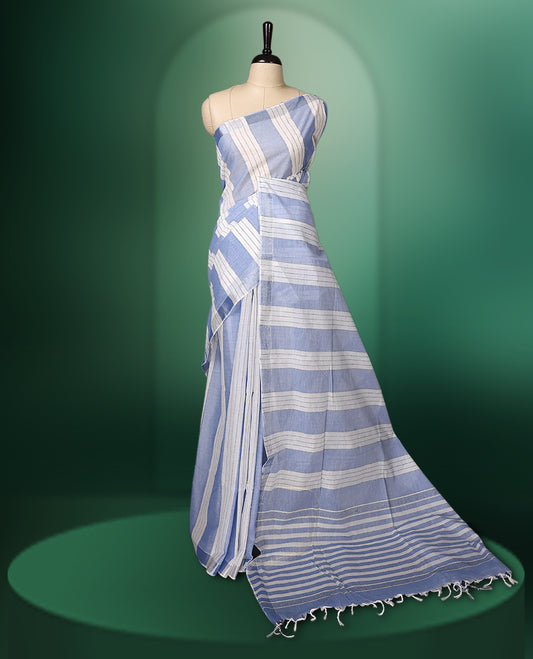 White and light blue colour striped cotton saree featuring a sleek, borderless design for a modern look, paired perfectly with a matching blouse for effortless style.
