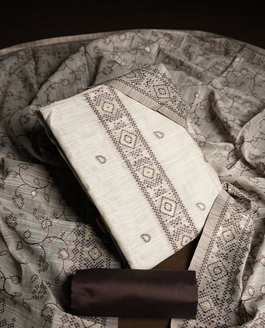 Cream colour churidhar material featuring Brown colour thread embroidery on the front panel, floral thread pattern dupatta with elegant border, and matching plain bottom.