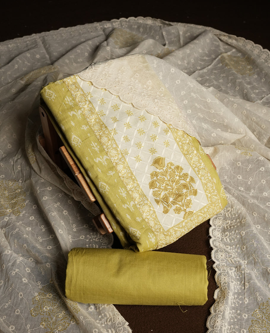 Pastel yellow and Off white cotton churidar material featuring elegant thread work on the neckline and floral prints on the body & Comes with an embroidered dupatta and matching plain bottom.