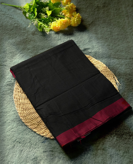 Black colour Narayanapattu cotton saree featuring a plain black body, deep maroon border and pallu, highlighted with fine thread work & Traditional and elegant, this saree comes without a blouse piece.
