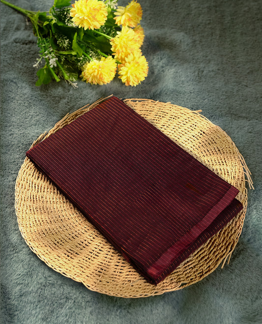 Coffee brown colour silk cotton saree featuring with full of delicate vertical copper zari lines on the body & rich contrasted pallu, Crafted without a border for a classy touch, Comes with a matching blouse for a perfectly coordinated look.
