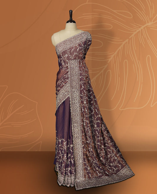 Purple & Brown colour velvet chiffon designer saree in elegant two tone shades, featuring light gold zari, kodi work with handwoven style thread aari & dori embroidery work, Swarovski stone work and all over motifs, comes with matching blouse.