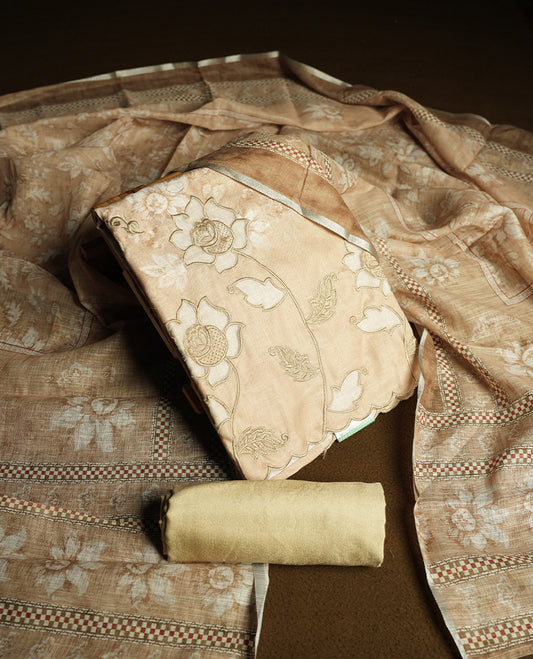 Beige colour churidhar material featuring floral and cutwork embroidery on the front panel, digital floral printed dupatta with elegant border, and matching plain bottom.
