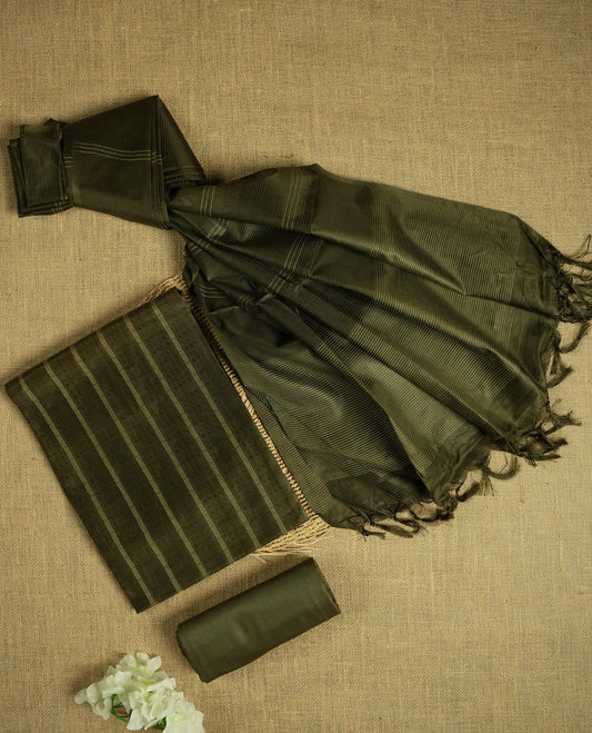 Army green colour tussar suit material featuring a subtle self woven pattern and vertical lines on the body, paired with a lightweight matching dupatta with tassel edges and a plain bottom piece.