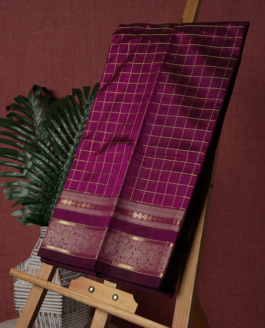 Deep Magenta colour pure Kanchi cotton saree featuring with delicate golden checks on body, paired with a contrasting beige zari woven border & Includes a matching blouse piece for a complete look.
