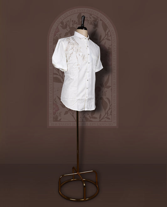 Off White colour cotton linen shirt featuring delicate embroidery work on the shoulder, designed with a mandarin collar and short sleeves for a refined yet comfortable style.