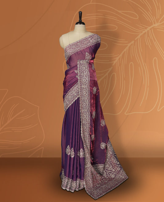 Onion pink colour velvet chiffon designer saree in elegant two tone shades, featuring light gold zari, kodi work with handwoven style thread aari & dori embroidery work, Swarovski stone work and all over motifs, comes with matching blouse.