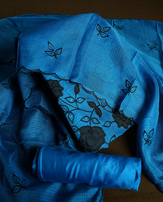 Blue colour churidhar material featuring Black colour thread embroidery on the front panel, self colour dupatta with elegant border, and matching plain bottom