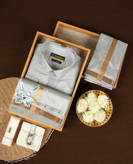 RAMRAJ  Silver Grey Colour kurtha paired with a Silver Grey dhoti and a Silver Grey towel, elegantly finished with a matching Gold border.