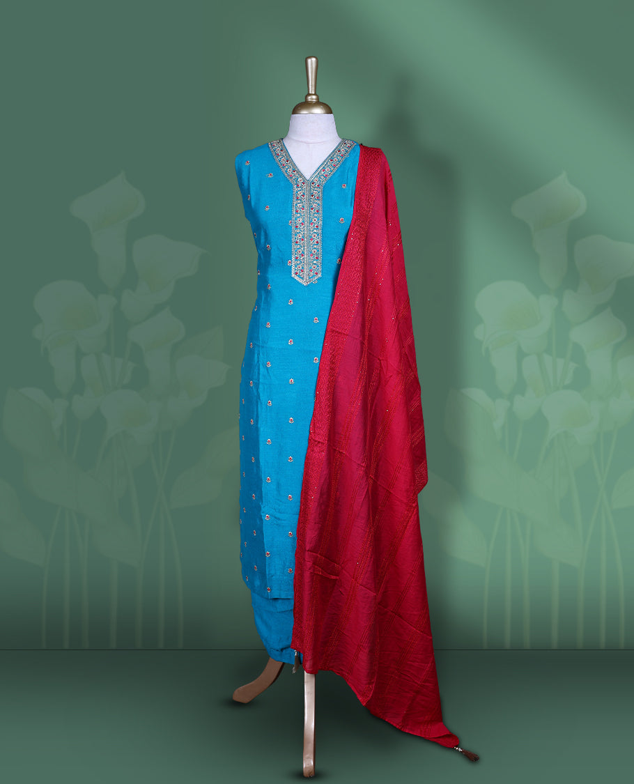 Bright blue colour churidar set featuring elegant white & red thread embroidery on the neckline, sleeveless, and scattered motifs across the body, Paired with a contrast rani pink colour plain dupatta