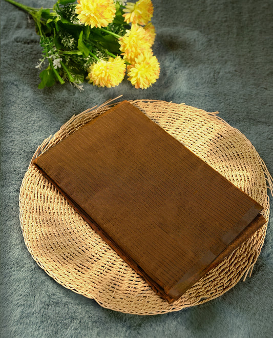 Dark mustard colour silk cotton saree featuring with full of delicate vertical copper zari lines on the body & black contrasted colour pallu, Crafted without a border for a classy touch, Comes with a matching blouse.