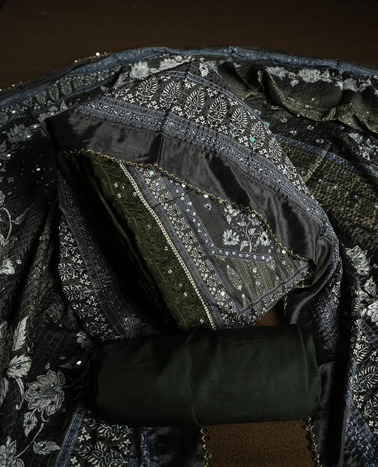 Dark Green colour churidhar material featuring Mirror and thread embroidery, foral print pattern on the self colour front panel, floral digital printed dupatta with elegant border, and matching plain bottom