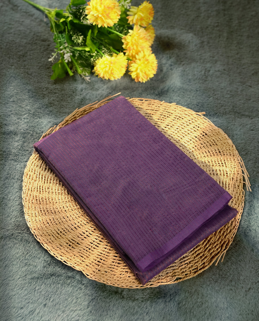 Lavender colour silk cotton saree featuring with full of delicate vertical copper zari lines on the body, Crafted without a border for a classy touch, Comes with a matching blouse for a perfectly coordinated look.