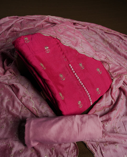 Dark pink colour churidhar material featuring thread embroidery on the front panel, contrast Light pink dupatta with elegant border, and matching plain bottom