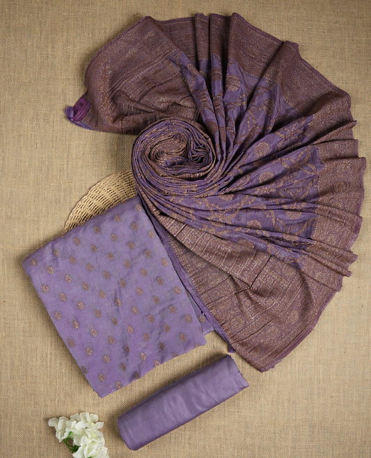 Lavender colour suit material adorned with delicate light copper toned zari work & Comes with a beautifully woven dupatta and matching plain bottom fabric.