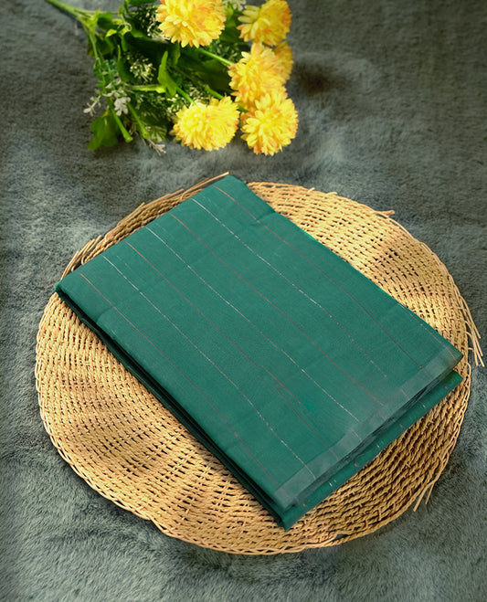 Sea green colour silk cotton saree featuring with delicate vertical copper & silver zari lines on the body, Crafted without a border for a classy touch, Comes with a matching blouse for a perfectly coordinated look.