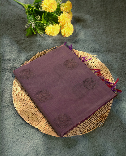 Deep mauve colour soft silk cotton saree adorned with copper zari motifs and a shimmering copper zari border, Enhanced by a beautifully rich grape colour woven pallu & Comes with a matching blouse piece for a complete look.