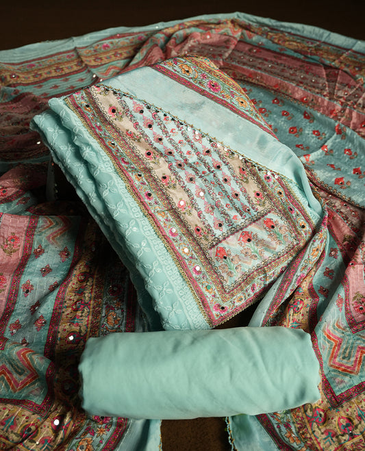 Light Aqua colour churidhar material featuring Mirror and thread embroidery, foral print pattern on the self colour front panel, floral digital printed dupatta with elegant border, and matching plain bottom