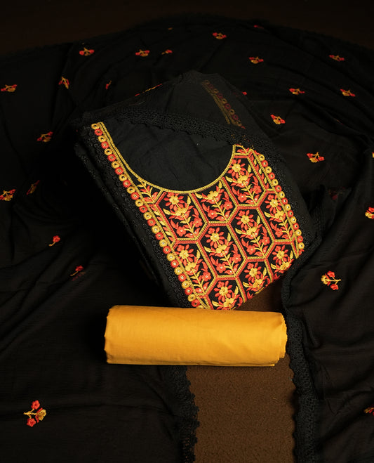 Black colour hakoba churidhar material featuring beautiful yellow and orange colour floral embroidery on the neckline and front panel, highlighted with lace detailing & Comes with an embroidered dupatta and contrast yellow bottom.
