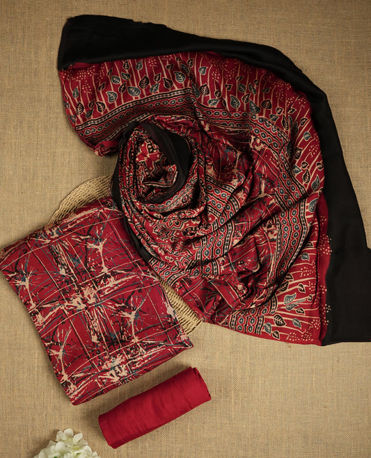 Deep maroon colour suit material featuring intricate hand block and batik inspired prints & Paired with a beautifully patterned dupatta and solid matching bottom.