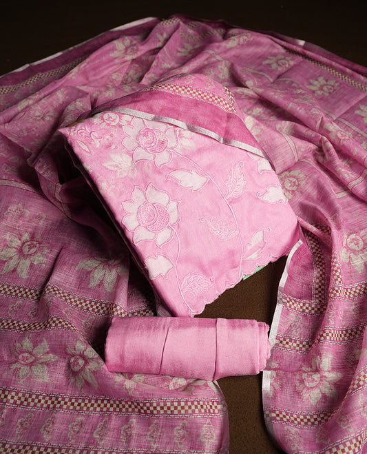 Pastel Magenta colour churidhar material featuring floral and cutwork embroidery on the front panel, digital floral printed dupatta with elegant border, and matching plain bottom.