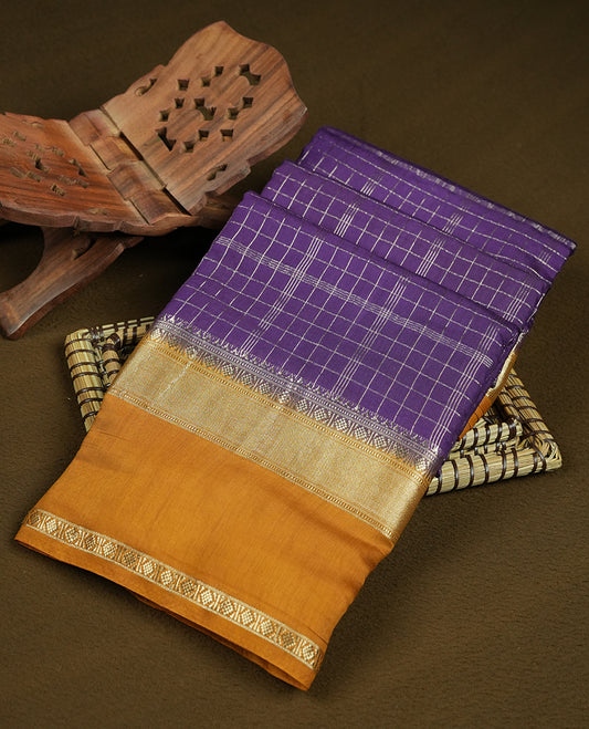 Purple colour mixed chanderi cotton saree with silver zari checkered body, mustard-golden pallu with grid pattern, golden zari border, and matching blouse