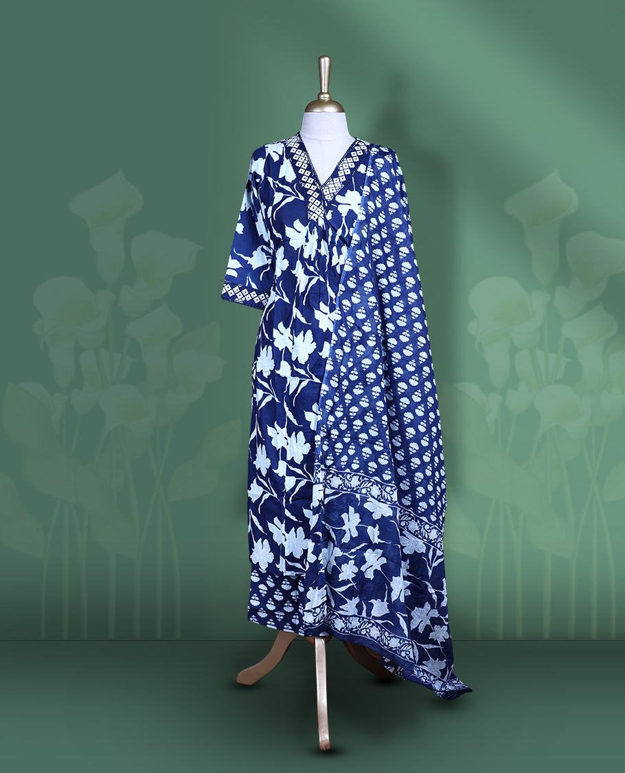 Dark blue colour churidar set featuring elegant white mirror on the neckline, sleeves, and white printed pattern across the body, Paired with a matching printed dupatta