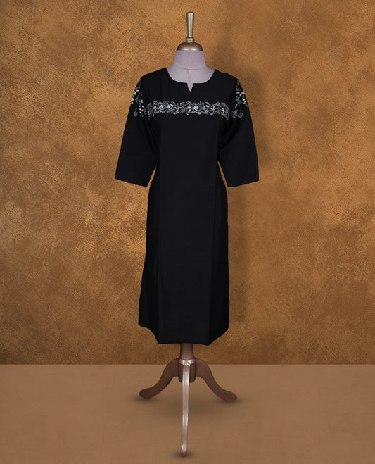 Black colour kurti by Talisha with round notch neckline, delicate floral yoke embroidery extending to the sleeves, straight calf‑length silhouette, and elbow‑length sleeves.