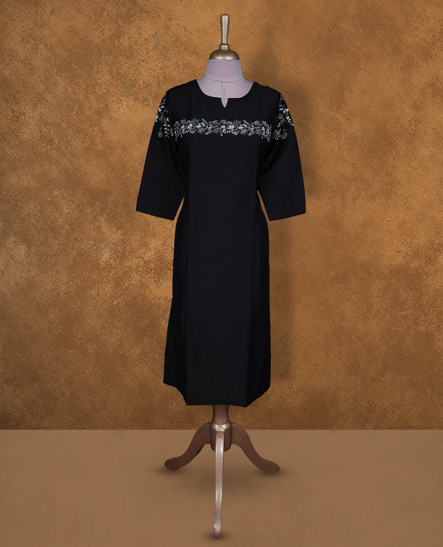 Black colour kurti by Talisha with round notch neckline, delicate floral yoke embroidery extending to the sleeves, straight calf‑length silhouette, and elbow‑length sleeves.