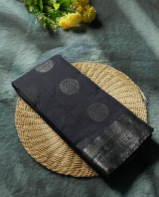 Navy blue colour silk cotton saree with shimmering silver zari border and intricately woven pallu, blending elegance and tradition, Paired with a matching blouse, perfect for festive celebrations and special occasions.
