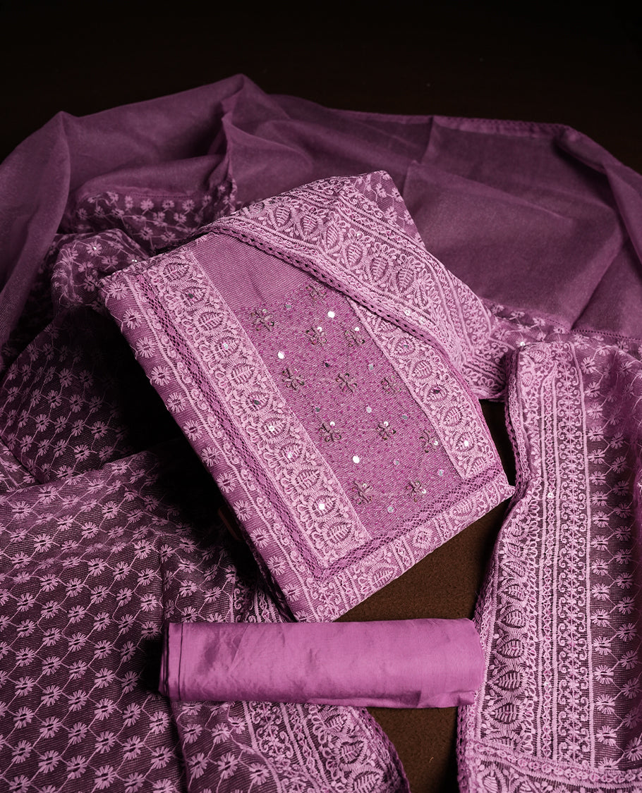 Purple Churidar Material featuring Intricate Thread Embroidery with Mirror and Cut Beads Work on the Front Panel, paired with an All Over Embroidered Net Dupatta and Matching Bottom