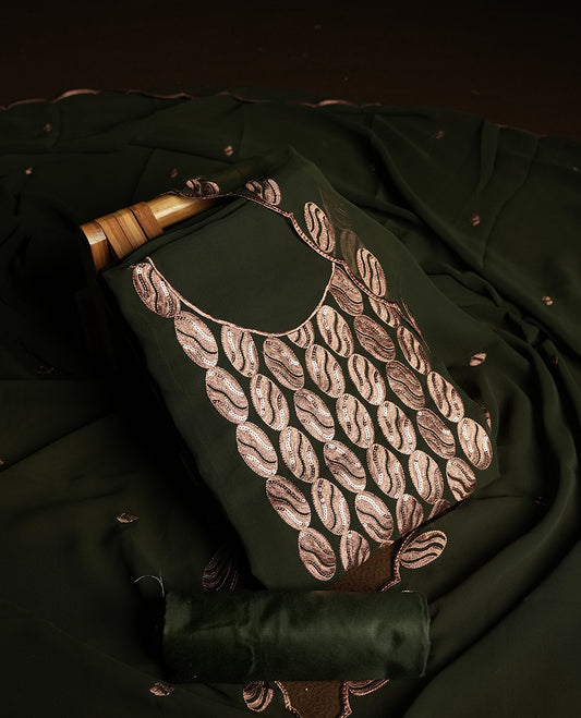 Dark Olive green colour churidar material adorned with intricate sequin embroidery on the neckline and body & dupatta comes with embroidered motifs and matching scalloped embroidered border & and plain bottom.